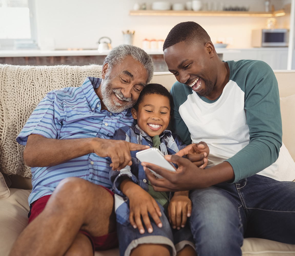 Happy Family Using Phone About Us